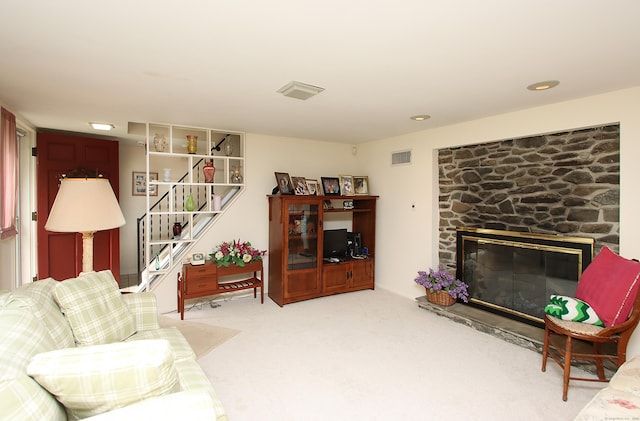 202 Wilson Rd, Orange, CT 06477 - living area featuring carpet floors, stairway, and a stone fireplace