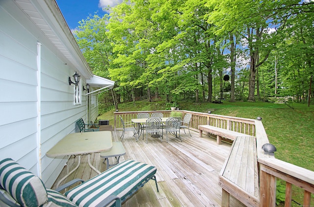 202 Wilson Rd, Orange, CT 06477 - wooden deck featuring outdoor dining space, a yard, and view of scattered trees