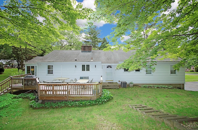 202 Wilson Rd, Orange, CT 06477 - rear view of property with a wooden deck, a chimney, a yard, and central air condition unit
