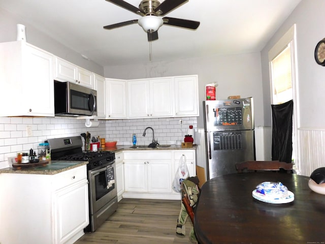 157 Madison Ter, Bridgeport, CT 06606 - kitchen with appliances with stainless steel finishes, a sink, white cabinetry, and a ceiling fan