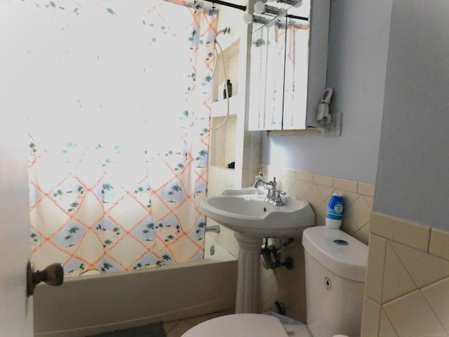 157 Madison Ter, Bridgeport, CT 06606 - full bath featuring toilet, shower / bath combination with curtain, tile walls, and a wainscoted wall