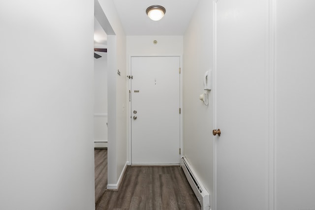 125 Warner Hill Rd Unit 74, Stratford, CT 06614 - hallway with a baseboard heating unit, wood finished floors, baseboard heating, and baseboards