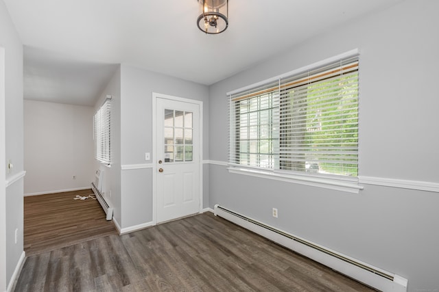 125 Warner Hill Rd Unit 74, Stratford, CT 06614 - entrance foyer featuring a baseboard radiator, wood finished floors, healthy amount of natural light, and baseboards