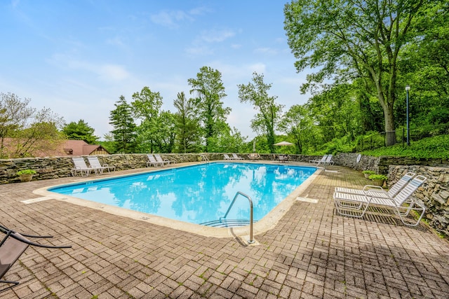 125 Warner Hill Rd Unit 74, Stratford, CT 06614 - community pool with a patio and view of wooded area