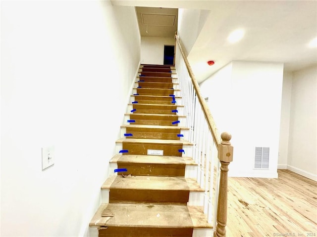 277 Trumbull Ave, Bridgeport, CT 06606 - stairs featuring wood finished floors and baseboards