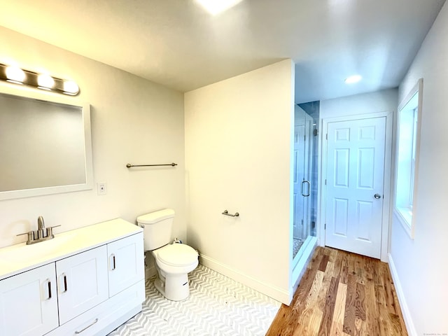 277 Trumbull Ave, Bridgeport, CT 06606 - bathroom featuring vanity, a stall shower, toilet, wood finished floors, and recessed lighting