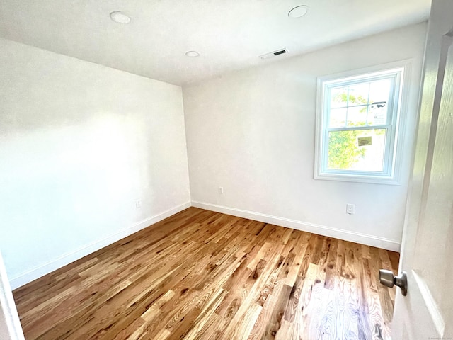 277 Trumbull Ave, Bridgeport, CT 06606 - empty room with wood finished floors and baseboards