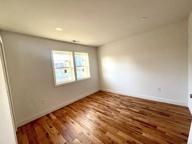 277 Trumbull Ave, Bridgeport, CT 06606 - spare room featuring wood finished floors, baseboards, and recessed lighting