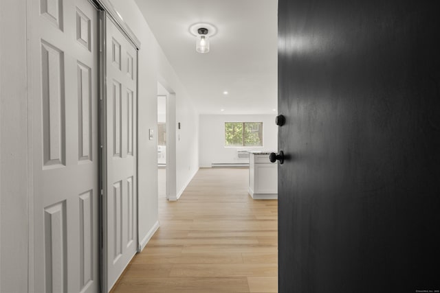 79 Claudia Dr Apt 254, West Haven, CT 06516 - hall with light wood-style flooring, baseboard heating, and baseboards