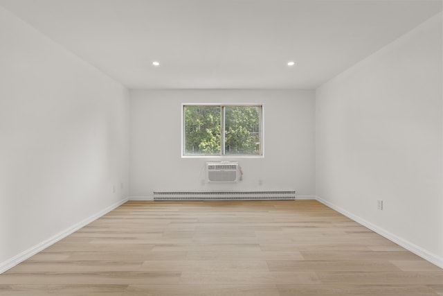 79 Claudia Dr Apt 254, West Haven, CT 06516 - spare room with light wood-type flooring, recessed lighting, baseboards, a wall mounted air conditioner, and baseboard heating