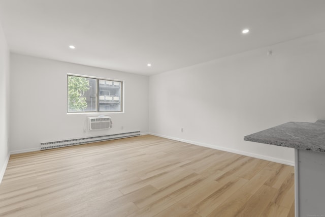 79 Claudia Dr Apt 254, West Haven, CT 06516 - empty room featuring baseboard heating, light wood-style flooring, an AC wall unit, recessed lighting, and baseboards