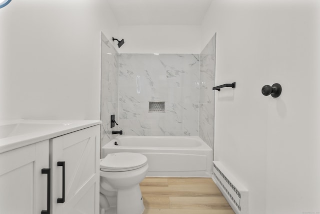 79 Claudia Dr Apt 254, West Haven, CT 06516 - full bathroom featuring a baseboard heating unit, toilet, vanity, wood finished floors, and washtub / shower combination