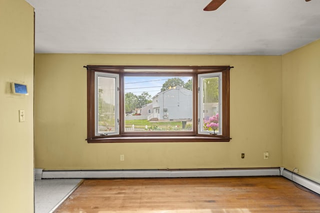 130 Jefferson Ln, East Hartford, CT 06118 - empty room featuring ceiling fan, a baseboard radiator, and wood finished floors