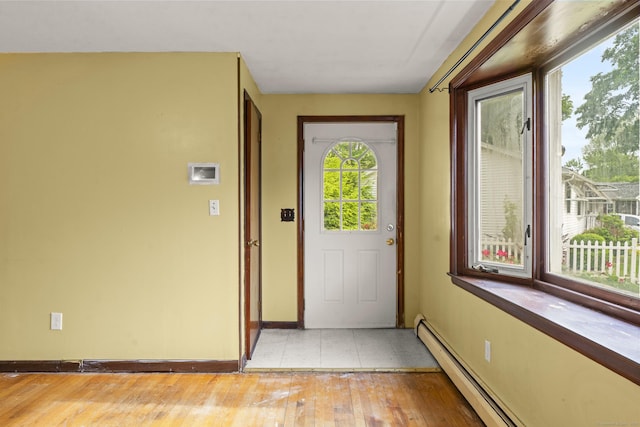 130 Jefferson Ln, East Hartford, CT 06118 - entryway featuring light wood-style flooring, baseboards, and a baseboard heating unit