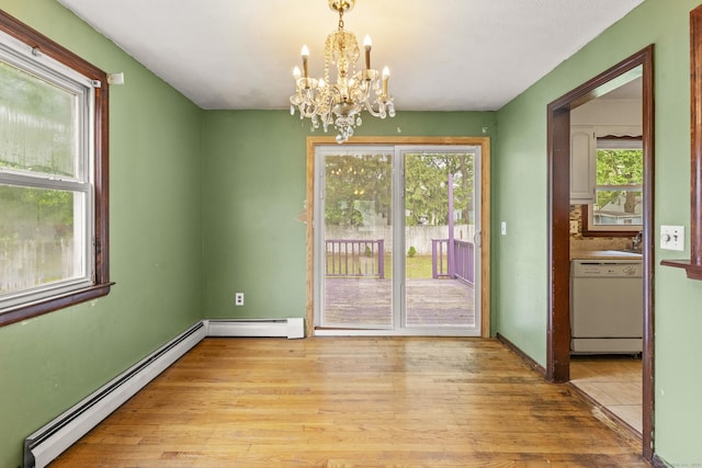 130 Jefferson Ln, East Hartford, CT 06118 - unfurnished dining area with baseboard heating, a chandelier, light wood-type flooring, and baseboards