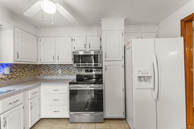 130 Jefferson Ln, East Hartford, CT 06118 - kitchen featuring appliances with stainless steel finishes, a ceiling fan, white cabinetry, and light tile patterned floors