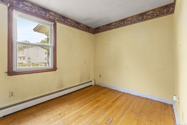130 Jefferson Ln, East Hartford, CT 06118 - empty room with a baseboard radiator, light wood-type flooring, and baseboards