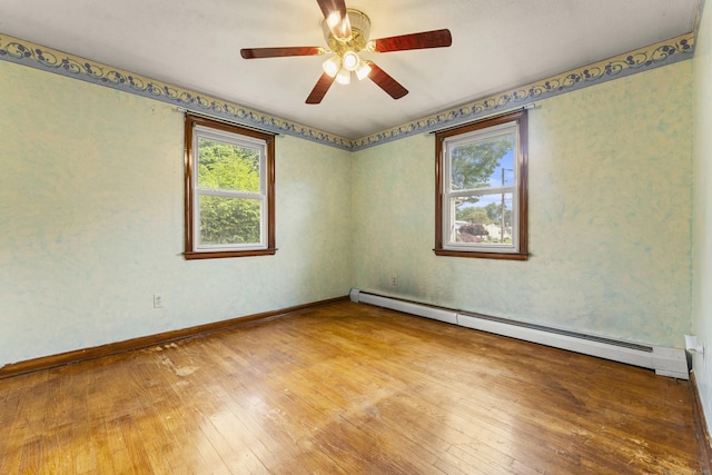130 Jefferson Ln, East Hartford, CT 06118 - unfurnished room featuring a baseboard heating unit, hardwood / wood-style flooring, a ceiling fan, and baseboards