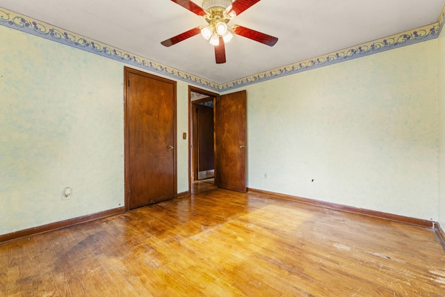 130 Jefferson Ln, East Hartford, CT 06118 - spare room featuring wood finished floors, a ceiling fan, and baseboards