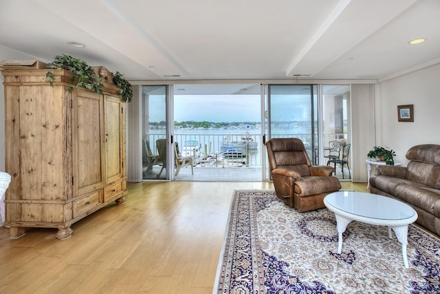 26 Cove Ave Apt 3B, Norwalk, CT 06855 - living room with expansive windows, light wood-style flooring, and a water view
