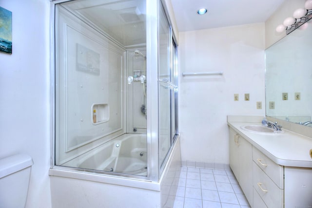26 Cove Ave Apt 3B, Norwalk, CT 06855 - bathroom with vanity, tile patterned flooring, toilet, enclosed tub / shower combo, and baseboards