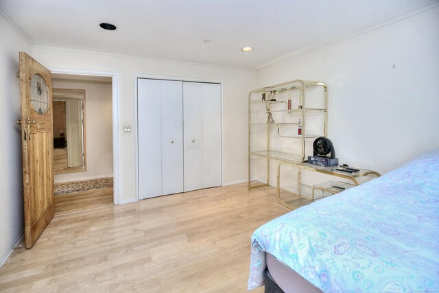 26 Cove Ave Apt 3B, Norwalk, CT 06855 - bedroom with light wood finished floors, ornamental molding, baseboards, a closet, and recessed lighting