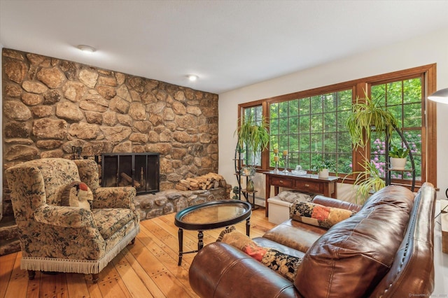 33 Cold Spring Rd, Avon, CT 06001 - living room featuring baseboard heating, hardwood / wood-style floors, and a fireplace