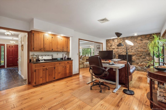 33 Cold Spring Rd, Avon, CT 06001 - office featuring light wood-style flooring, a chandelier, and a sink