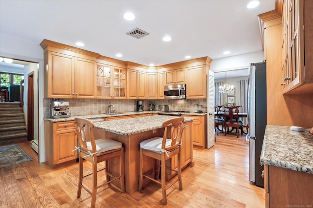 33 Cold Spring Rd, Avon, CT 06001 - kitchen featuring stainless steel appliances, light wood finished floors, backsplash, a sink, and recessed lighting