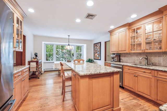 33 Cold Spring Rd, Avon, CT 06001 - kitchen featuring dishwasher, a sink, tasteful backsplash, light wood-style floors, and a center island