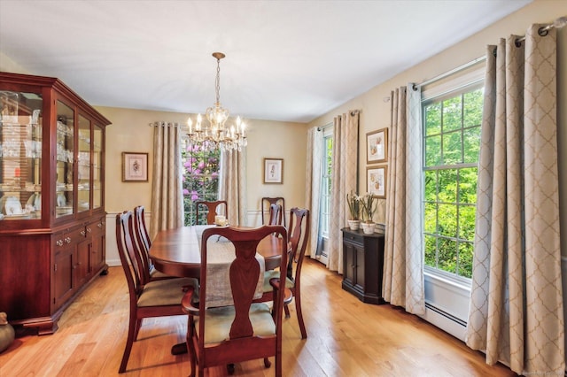 33 Cold Spring Rd, Avon, CT 06001 - dining area featuring a chandelier, light wood-style floors, and a baseboard radiator