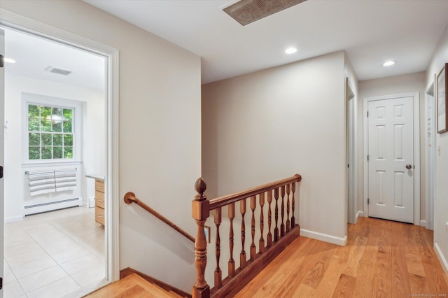 33 Cold Spring Rd, Avon, CT 06001 - hall with a baseboard heating unit, an upstairs landing, light wood finished floors, baseboards, and recessed lighting