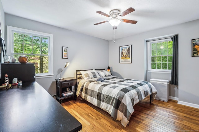 33 Cold Spring Rd, Avon, CT 06001 - bedroom with multiple windows, hardwood / wood-style flooring, and baseboards