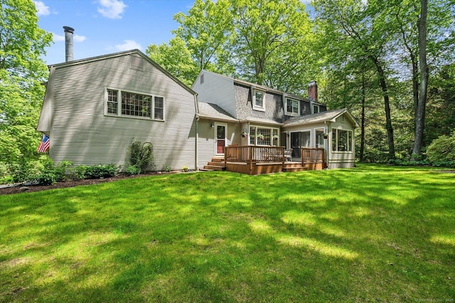 33 Cold Spring Rd, Avon, CT 06001 - rear view of house featuring a chimney, a wooden deck, and a lawn