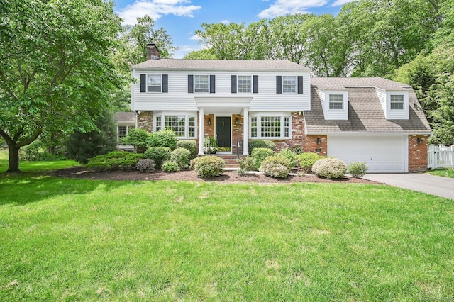 15 Stony Cors, Avon, CT 06001 - view of front of house featuring brick siding, a chimney, concrete driveway, a shingled roof, and an attached garage