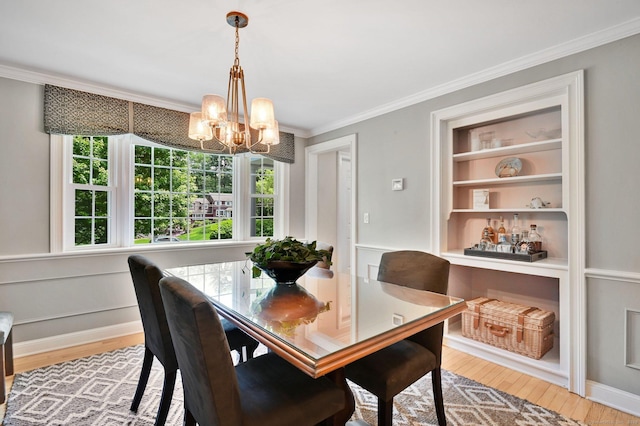 15 Stony Cors, Avon, CT 06001 - dining room featuring a chandelier, wood finished floors, healthy amount of natural light, and ornamental molding
