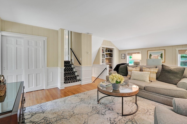 15 Stony Cors, Avon, CT 06001 - living room with wood finished floors, a decorative wall, and stairs