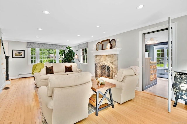 15 Stony Cors, Avon, CT 06001 - living room with baseboard heating, stairs, light wood finished floors, ornamental molding, and recessed lighting