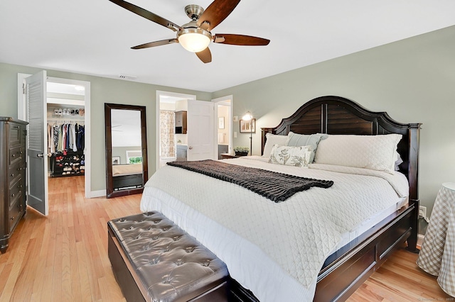 15 Stony Cors, Avon, CT 06001 - bedroom with a spacious closet, light wood-style flooring, a closet, and a ceiling fan