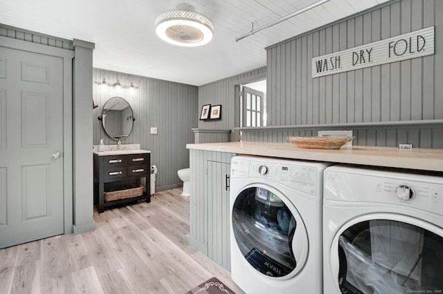 15 Stony Cors, Avon, CT 06001 - laundry room with washer and dryer and light wood-style flooring