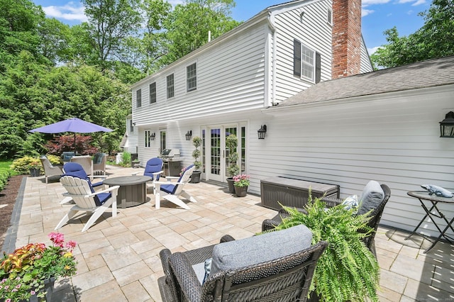 15 Stony Cors, Avon, CT 06001 - view of patio featuring an outdoor fire pit, grilling area, and french doors
