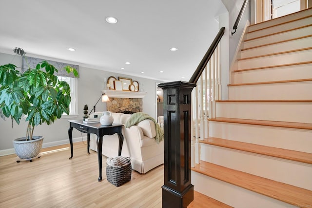15 Stony Cors, Avon, CT 06001 - living room with stairs, light wood finished floors, a stone fireplace, recessed lighting, and baseboards