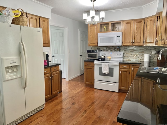 10 Richards Ave, Seymour, CT 06483 - kitchen featuring white appliances, a sink, dark countertops, backsplash, and brown cabinets