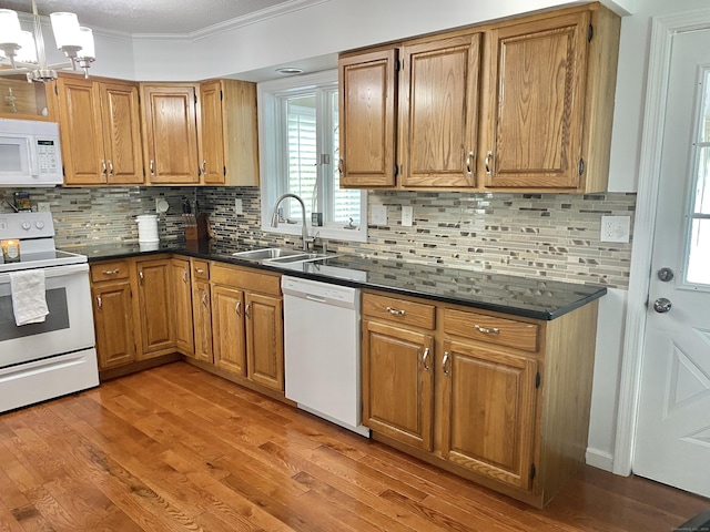 10 Richards Ave, Seymour, CT 06483 - kitchen with white appliances, a sink, crown molding, dark countertops, and decorative backsplash