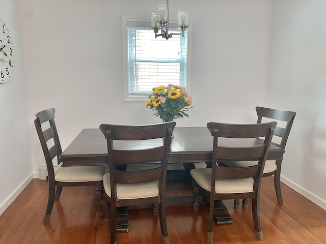 10 Richards Ave, Seymour, CT 06483 - dining area featuring a chandelier, hardwood / wood-style floors, and baseboards