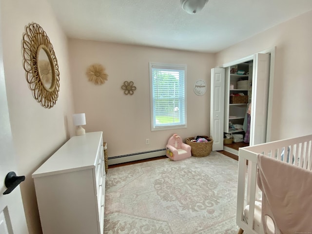 10 Richards Ave, Seymour, CT 06483 - bedroom featuring a baseboard heating unit and a closet