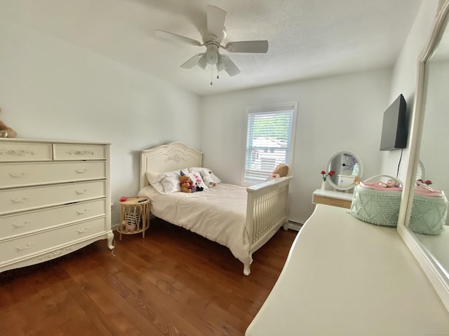 10 Richards Ave, Seymour, CT 06483 - bedroom with dark wood-style flooring, baseboard heating, and a ceiling fan