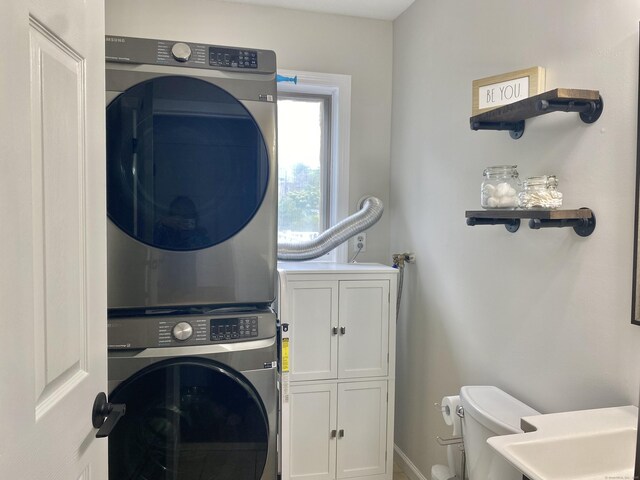 10 Richards Ave, Seymour, CT 06483 - laundry area with stacked washer / drying machine, baseboards, and cabinet space
