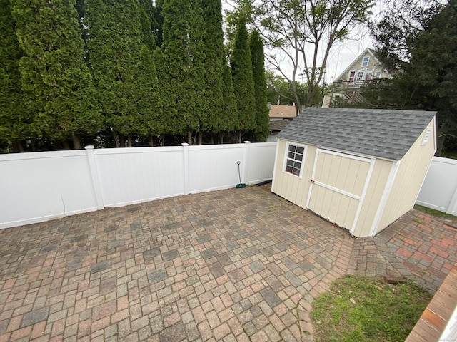 10 Richards Ave, Seymour, CT 06483 - fenced backyard with a patio area