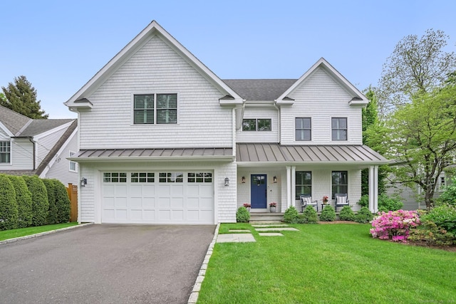 5 Oakleigh Ct, Norwalk, CT 06853 - view of front of home with a standing seam roof, asphalt driveway, a porch, and a garage